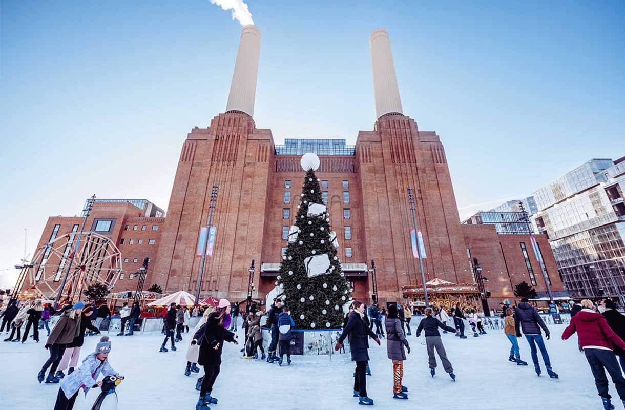 A Christmas tree on the ice in front of Battersea Power Station