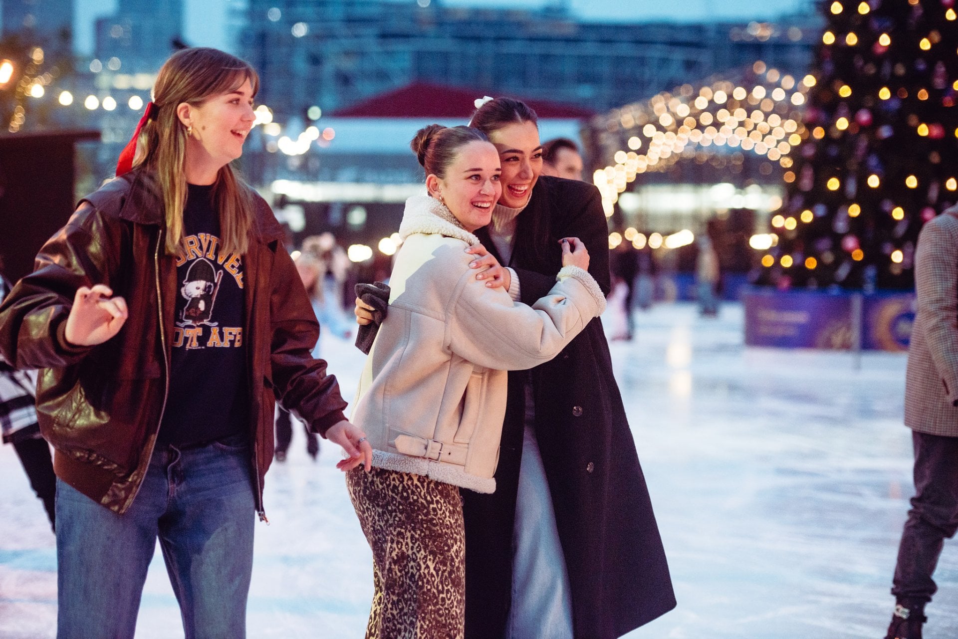 Friends on the ice laughing