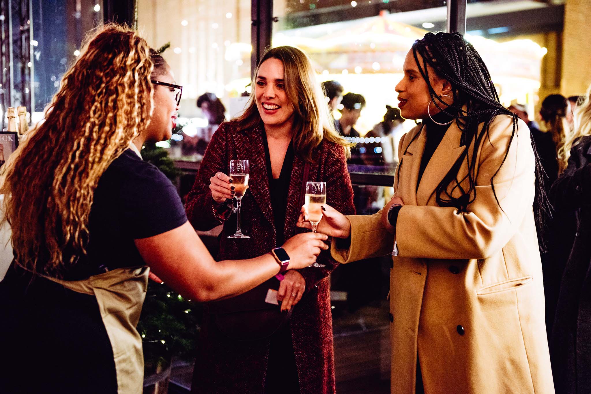 People being served a drink in The Glass House