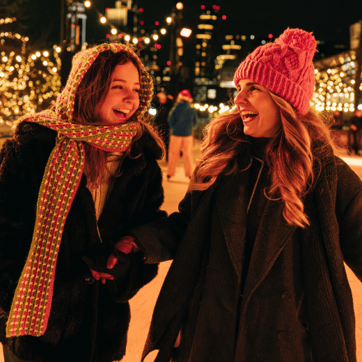 Friends laughing on skating rink