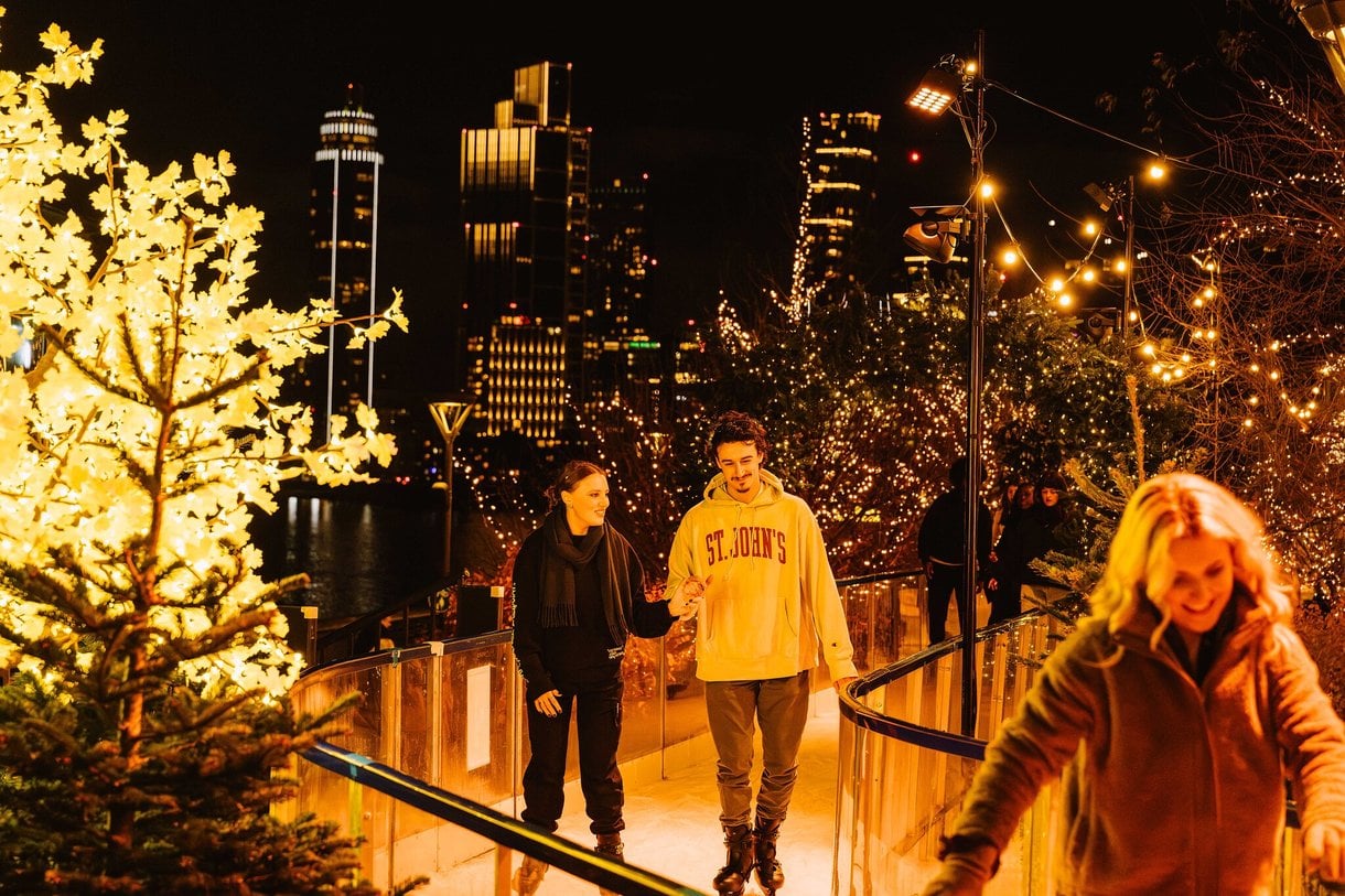 Two people skating on skate trail at night