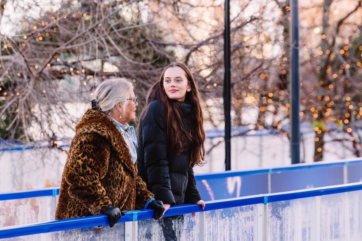 Two people smiling on skate trail