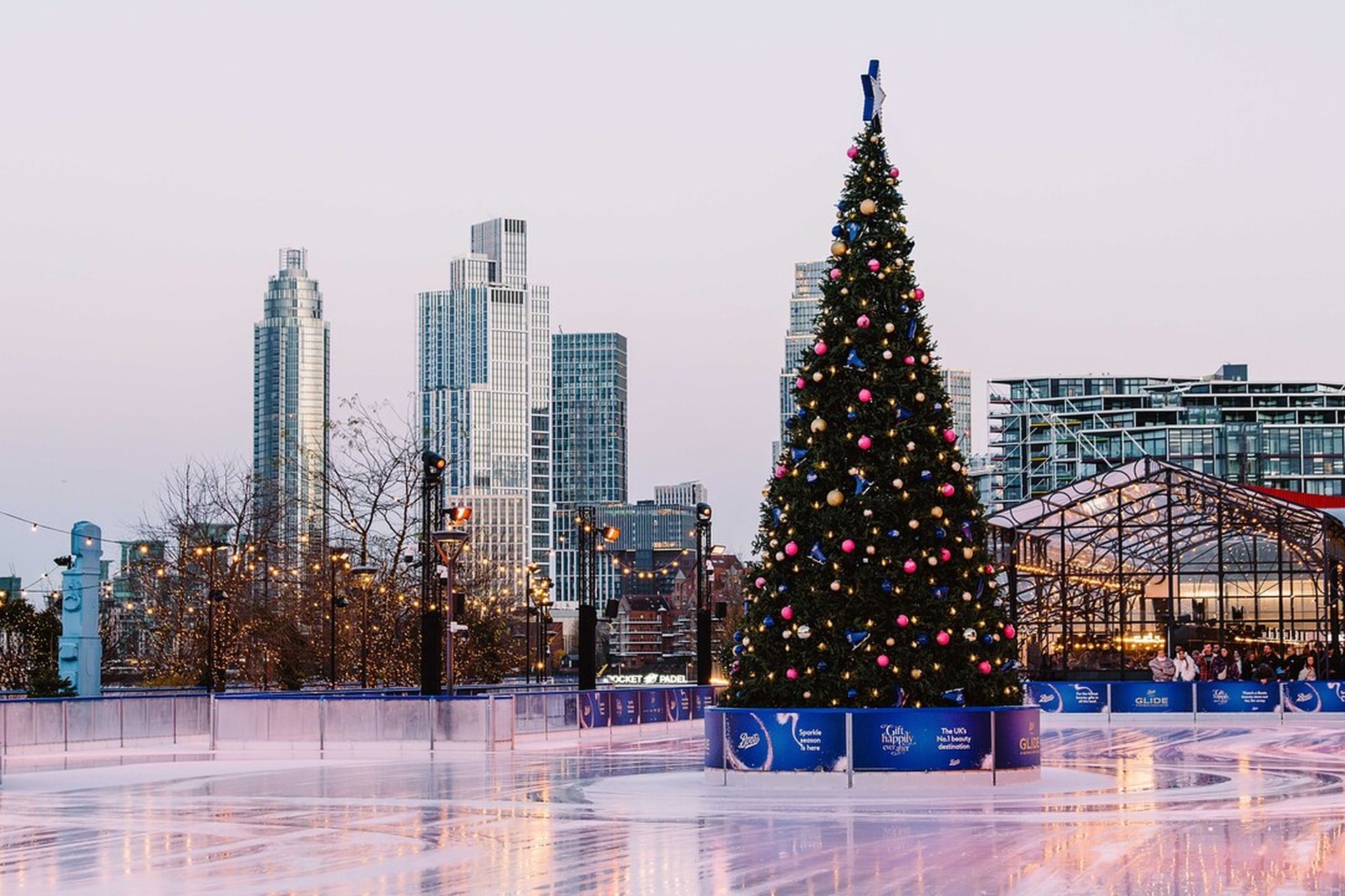 Empty ice rink with view of London skyline in the background
